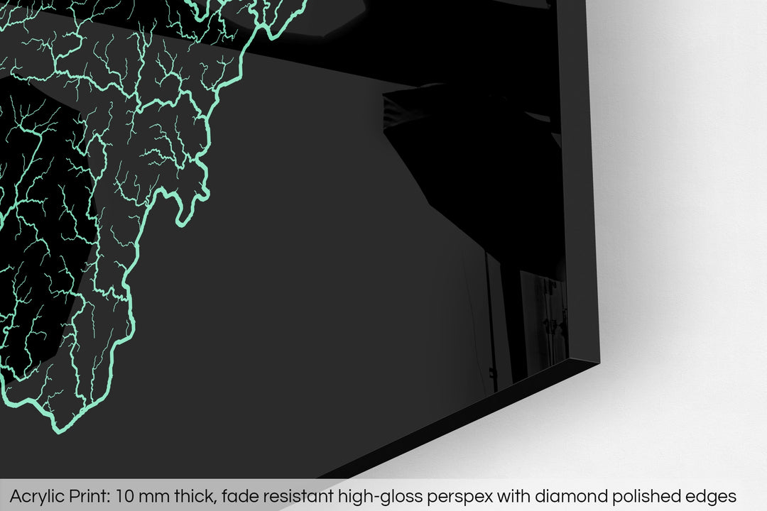 Closeup of an acrylic panel's corner, the details of a Grasshopper Geography map is visible. The text at the bottom reads: Acrylic print - 10 mm thick, fade reistant high-gloss perspex with diamond polished edges.