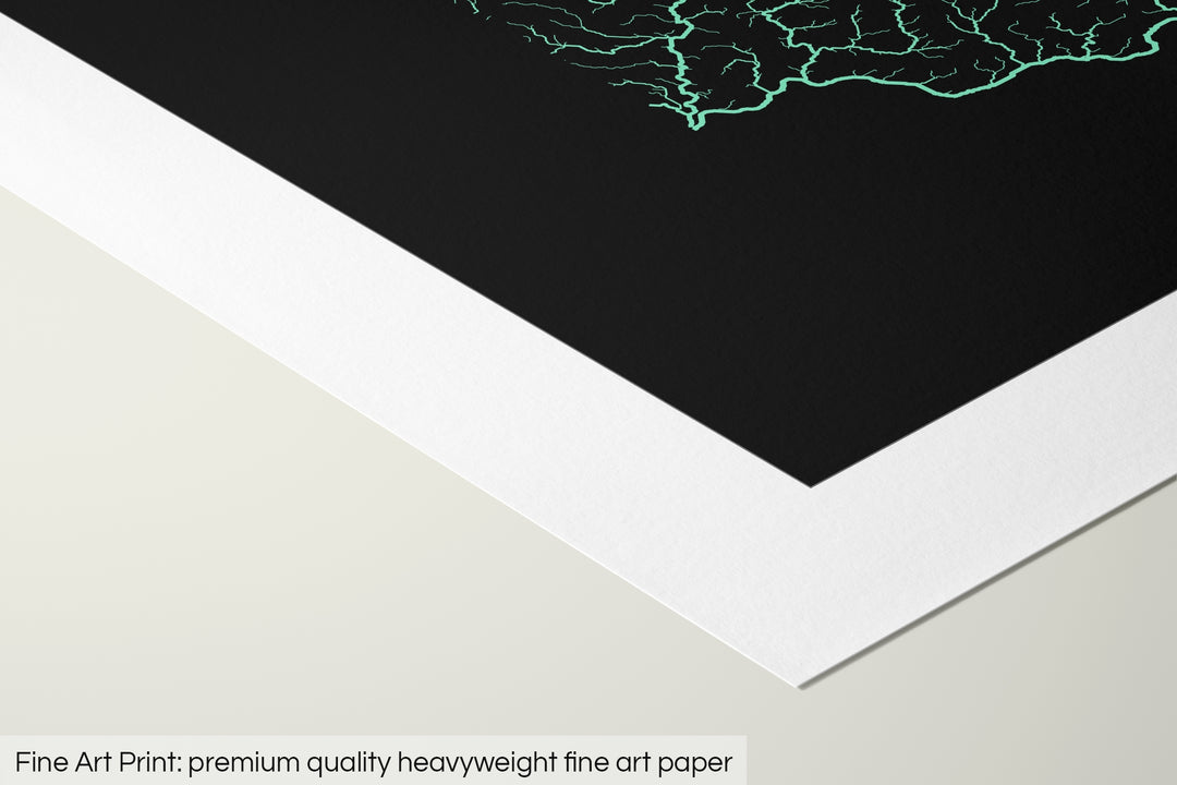 Closeup of a fine art print's corner lying on a flat surface, the details of a Grasshopper Geography map is visible. The text at the bottom reads: Fine art print - premium quality heavyweight fine art paper.