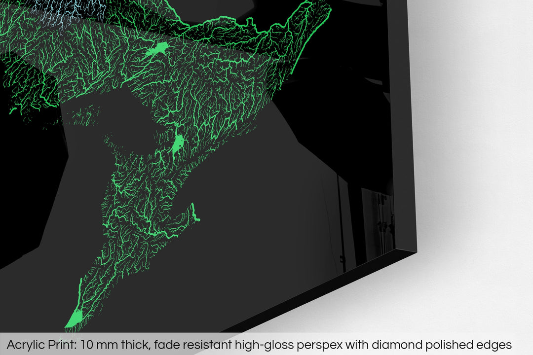 Closeup of an acrylic panel's corner, the details of a Grasshopper Geography map is visible. The text at the bottom reads: Acrylic print - 10 mm thick, fade reistant high-gloss perspex with diamond polished edges.