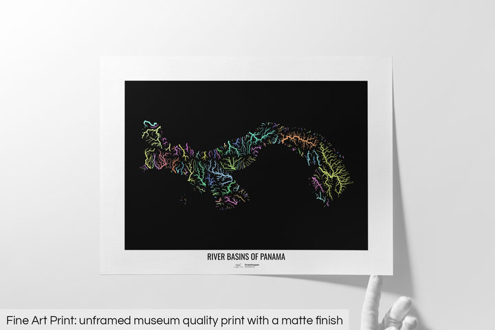 Unframed fine art print of a colourful map with a thick white mat. The title of the map and the Grasshopper Geography logo is printed on the mat, below the image. The map print lies flat on a white surface, a hand holding up one of the corners. The bottom text reads: Fine art print - unframed museum quality print with a matte finish.