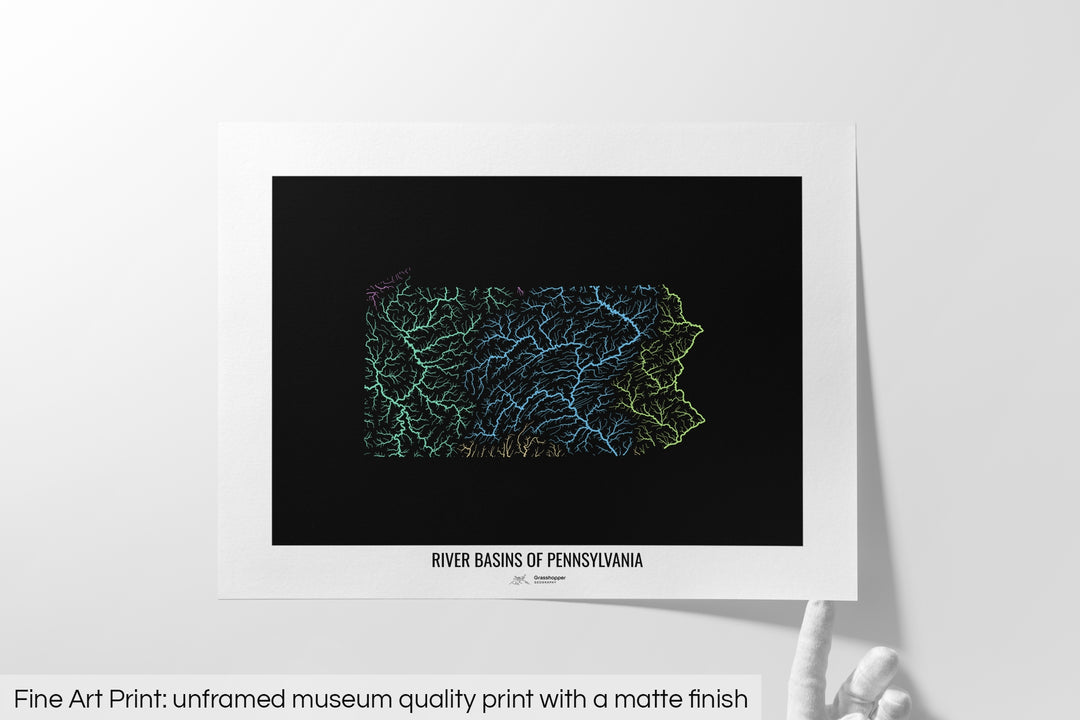 Unframed fine art print of a colourful map with a thick white mat. The title of the map and the Grasshopper Geography logo is printed on the mat, below the image. The map print lies flat on a white surface, a hand holding up one of the corners. The bottom text reads: Fine art print - unframed museum quality print with a matte finish.