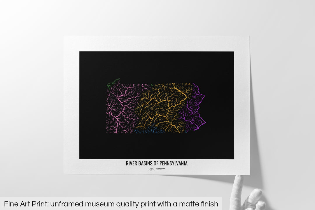 Unframed fine art print of a colourful map with a thick white mat. The title of the map and the Grasshopper Geography logo is printed on the mat, below the image. The map print lies flat on a white surface, a hand holding up one of the corners. The bottom text reads: Fine art print - unframed museum quality print with a matte finish.
