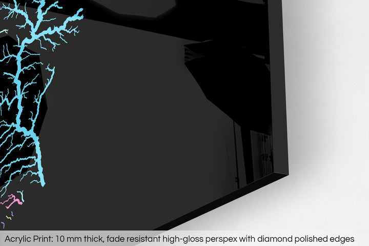Closeup of an acrylic panel's corner, the details of a Grasshopper Geography map is visible. The text at the bottom reads: Acrylic print - 10 mm thick, fade reistant high-gloss perspex with diamond polished edges.