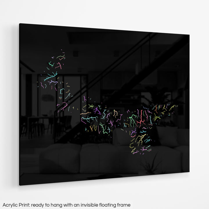 A colourful Grasshopper Geography map hanging on a white wall. The text at the bottom reads: Acrylic print - ready to hang with an invisible floating frame.