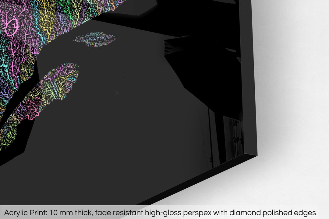 Closeup of an acrylic panel's corner, the details of a Grasshopper Geography map is visible. The text at the bottom reads: Acrylic print - 10 mm thick, fade reistant high-gloss perspex with diamond polished edges.