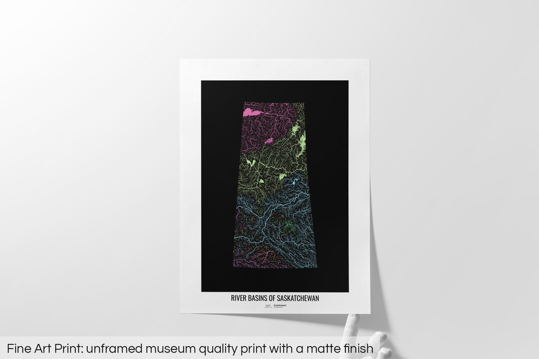 Unframed fine art print of a colourful map with a thick white mat. The title of the map and the Grasshopper Geography logo is printed on the mat, below the image. The map print lies flat on a white surface, a hand holding up one of the corners. The bottom text reads: Fine art print - unframed museum quality print with a matte finish.
