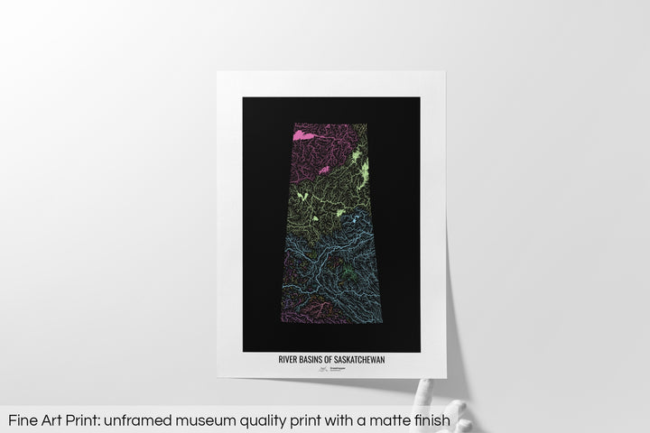 Unframed fine art print of a colourful map with a thick white mat. The title of the map and the Grasshopper Geography logo is printed on the mat, below the image. The map print lies flat on a white surface, a hand holding up one of the corners. The bottom text reads: Fine art print - unframed museum quality print with a matte finish.