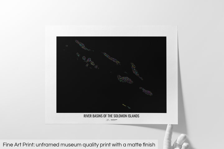 Unframed fine art print of a colourful map with a thick white mat. The title of the map and the Grasshopper Geography logo is printed on the mat, below the image. The map print lies flat on a white surface, a hand holding up one of the corners. The bottom text reads: Fine art print - unframed museum quality print with a matte finish.