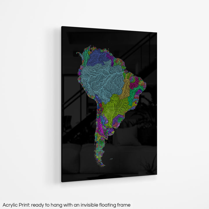 A colourful Grasshopper Geography map hanging on a white wall. The text at the bottom reads: Acrylic print - ready to hang with an invisible floating frame.