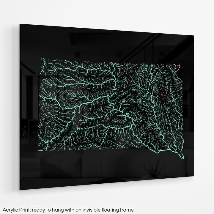 A colourful Grasshopper Geography map hanging on a white wall. The text at the bottom reads: Acrylic print - ready to hang with an invisible floating frame.