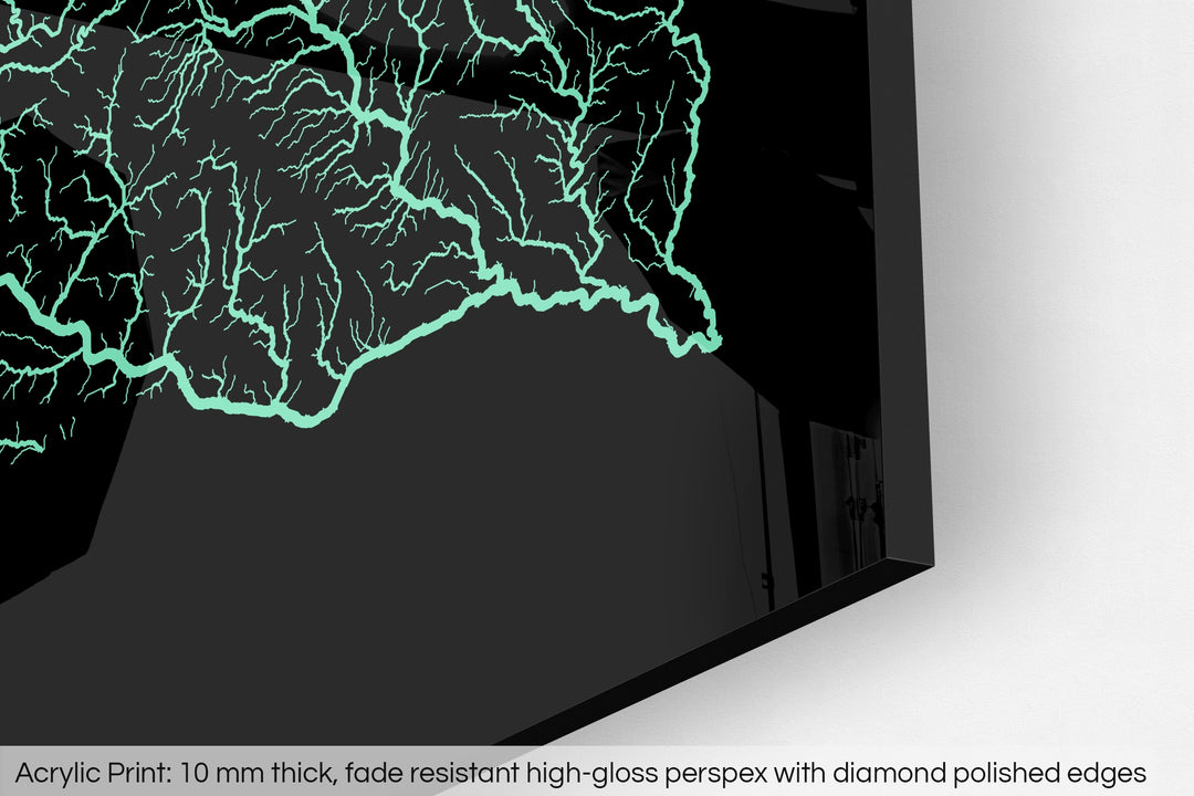 Closeup of an acrylic panel's corner, the details of a Grasshopper Geography map is visible. The text at the bottom reads: Acrylic print - 10 mm thick, fade reistant high-gloss perspex with diamond polished edges.