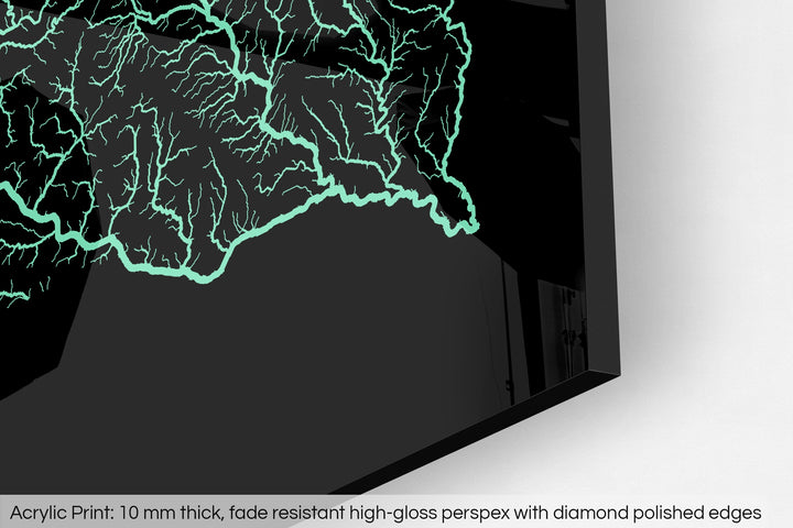 Closeup of an acrylic panel's corner, the details of a Grasshopper Geography map is visible. The text at the bottom reads: Acrylic print - 10 mm thick, fade reistant high-gloss perspex with diamond polished edges.