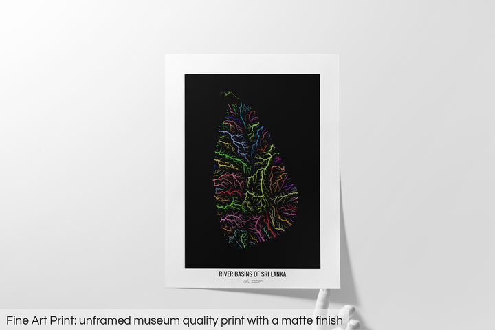 Unframed fine art print of a colourful map with a thick white mat. The title of the map and the Grasshopper Geography logo is printed on the mat, below the image. The map print lies flat on a white surface, a hand holding up one of the corners. The bottom text reads: Fine art print - unframed museum quality print with a matte finish.