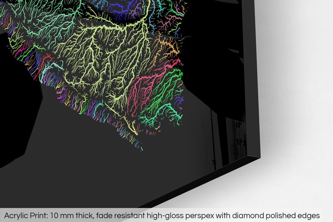 Closeup of an acrylic panel's corner, the details of a Grasshopper Geography map is visible. The text at the bottom reads: Acrylic print - 10 mm thick, fade reistant high-gloss perspex with diamond polished edges.