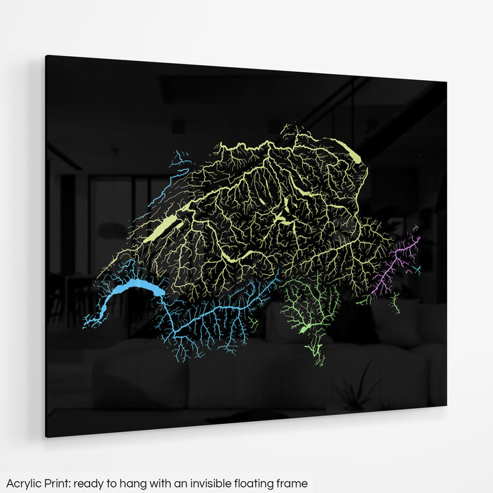 A colourful Grasshopper Geography map hanging on a white wall. The text at the bottom reads: Acrylic print - ready to hang with an invisible floating frame.