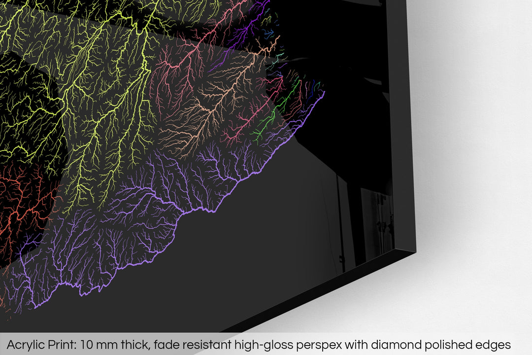 Closeup of an acrylic panel's corner, the details of a Grasshopper Geography map is visible. The text at the bottom reads: Acrylic print - 10 mm thick, fade reistant high-gloss perspex with diamond polished edges.