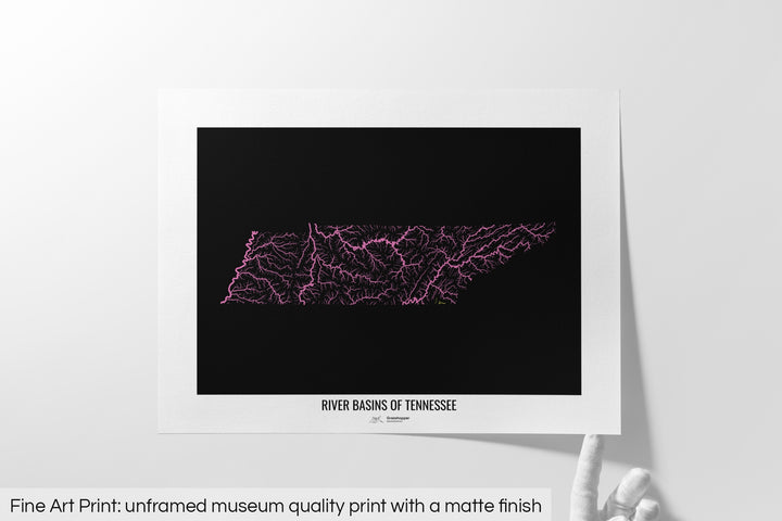 Unframed fine art print of a colourful map with a thick white mat. The title of the map and the Grasshopper Geography logo is printed on the mat, below the image. The map print lies flat on a white surface, a hand holding up one of the corners. The bottom text reads: Fine art print - unframed museum quality print with a matte finish.