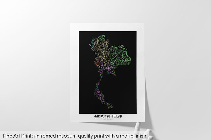 Unframed fine art print of a colourful map with a thick white mat. The title of the map and the Grasshopper Geography logo is printed on the mat, below the image. The map print lies flat on a white surface, a hand holding up one of the corners. The bottom text reads: Fine art print - unframed museum quality print with a matte finish.