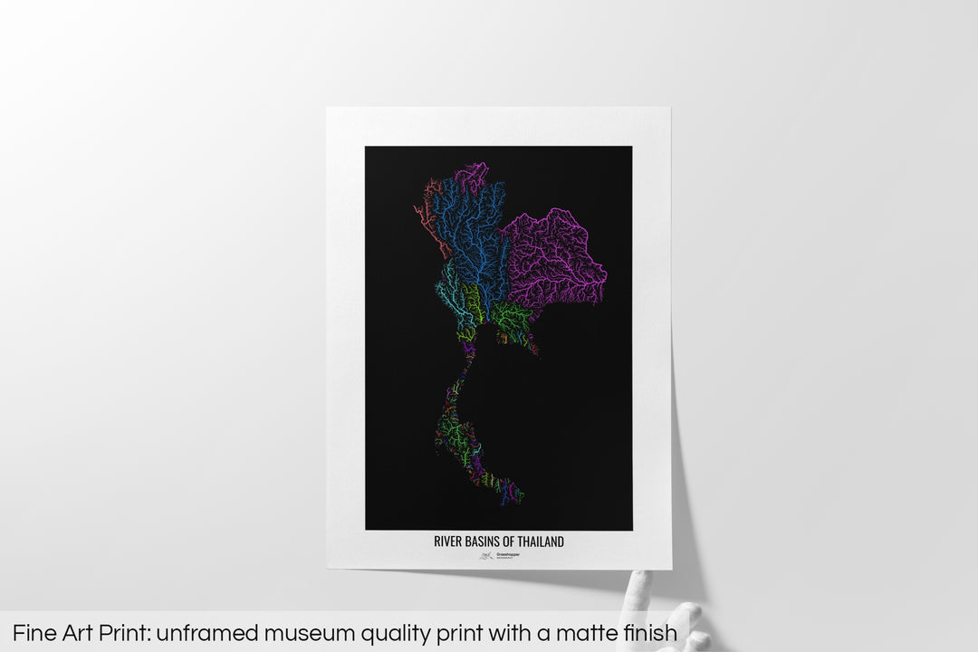Unframed fine art print of a colourful map with a thick white mat. The title of the map and the Grasshopper Geography logo is printed on the mat, below the image. The map print lies flat on a white surface, a hand holding up one of the corners. The bottom text reads: Fine art print - unframed museum quality print with a matte finish.