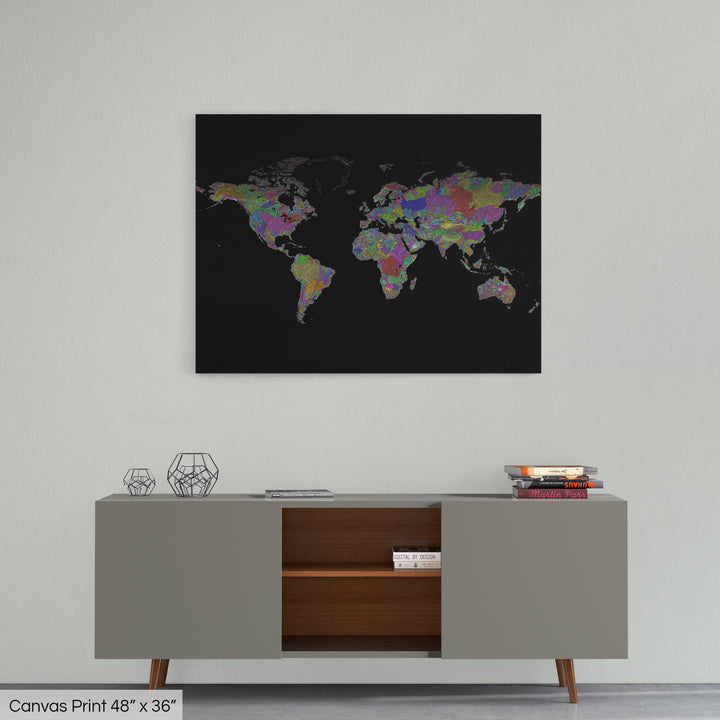A colourful Grasshopper Geography map home decor in a living room, on a light grey wall. The map is printed on canvas and hangs above a modern low storage cabinet.