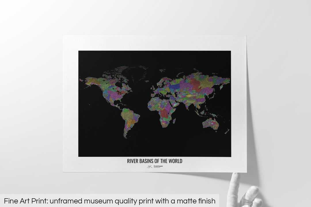 Unframed fine art print of a colourful map with a thick white mat. The title of the map and the Grasshopper Geography logo is printed on the mat, below the image. The map print lies flat on a white surface, a hand holding up one of the corners. The bottom text reads: Fine art print - unframed museum quality print with a matte finish.