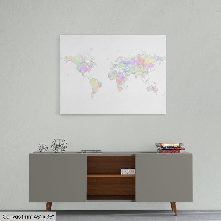 A colourful Grasshopper Geography map home decor in a living room, on a light grey wall. The map is printed on canvas and hangs above a modern low storage cabinet.