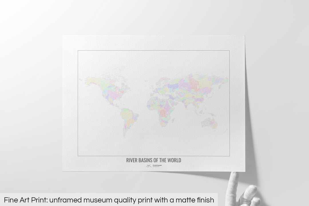Unframed fine art print of a colourful map with a thick white mat. The title of the map and the Grasshopper Geography logo is printed on the mat, below the image. The map print lies flat on a white surface, a hand holding up one of the corners. The bottom text reads: Fine art print - unframed museum quality print with a matte finish.