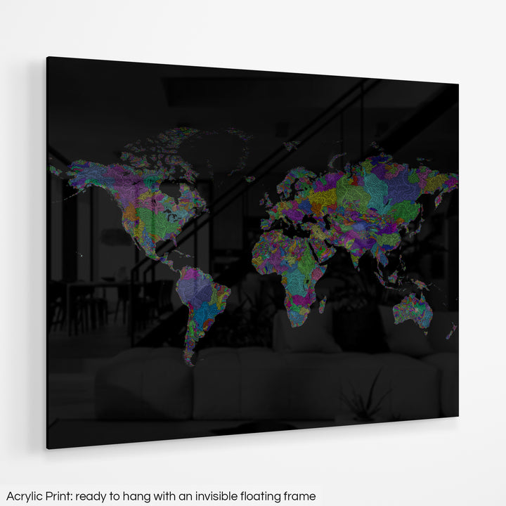 A colourful Grasshopper Geography map hanging on a white wall. The text at the bottom reads: Acrylic print - ready to hang with an invisible floating frame.