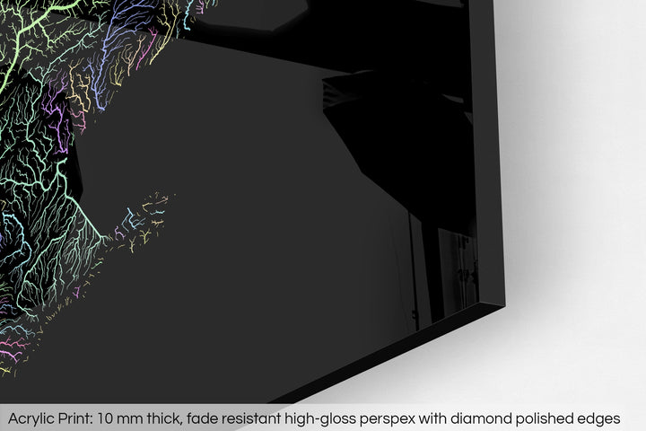 Closeup of an acrylic panel's corner, the details of a Grasshopper Geography map is visible. The text at the bottom reads: Acrylic print - 10 mm thick, fade reistant high-gloss perspex with diamond polished edges.