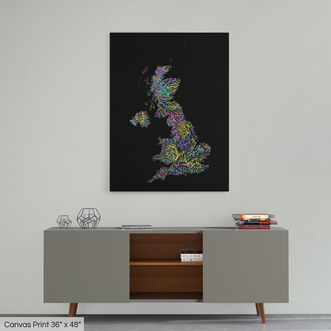 A colourful Grasshopper Geography map home decor in a living room, on a light grey wall. The map is printed on canvas and hangs above a modern low storage cabinet.