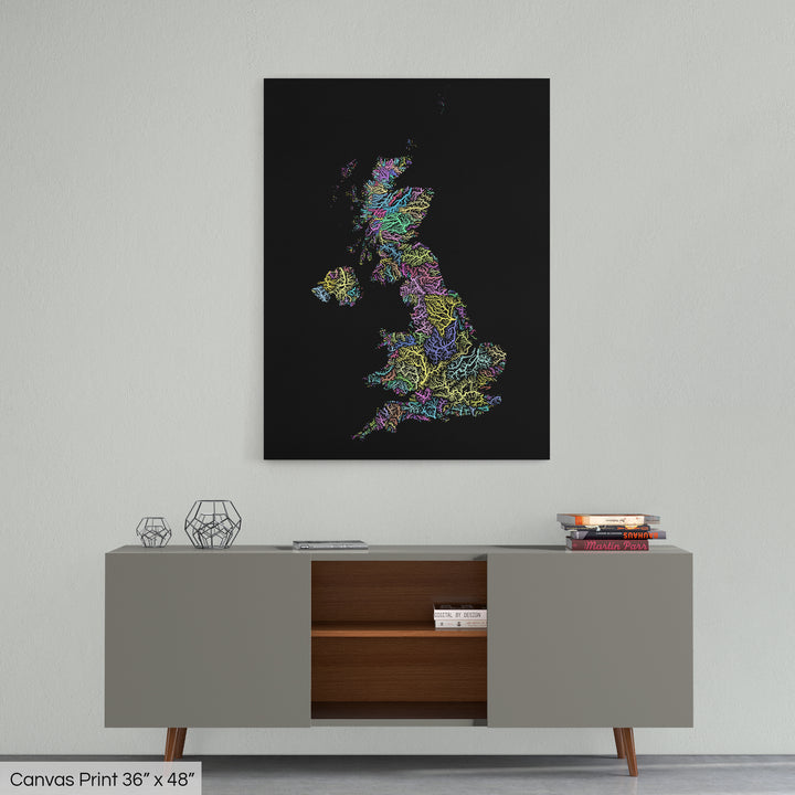 A colourful Grasshopper Geography map home decor in a living room, on a light grey wall. The map is printed on canvas and hangs above a modern low storage cabinet.