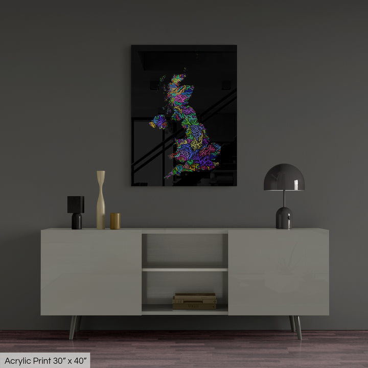 A colourful Grasshopper Geography map, home decor hanging on a grey wall in a living room. The map is printed on an acrylic panel and hangs above a modern low storage cabinet.