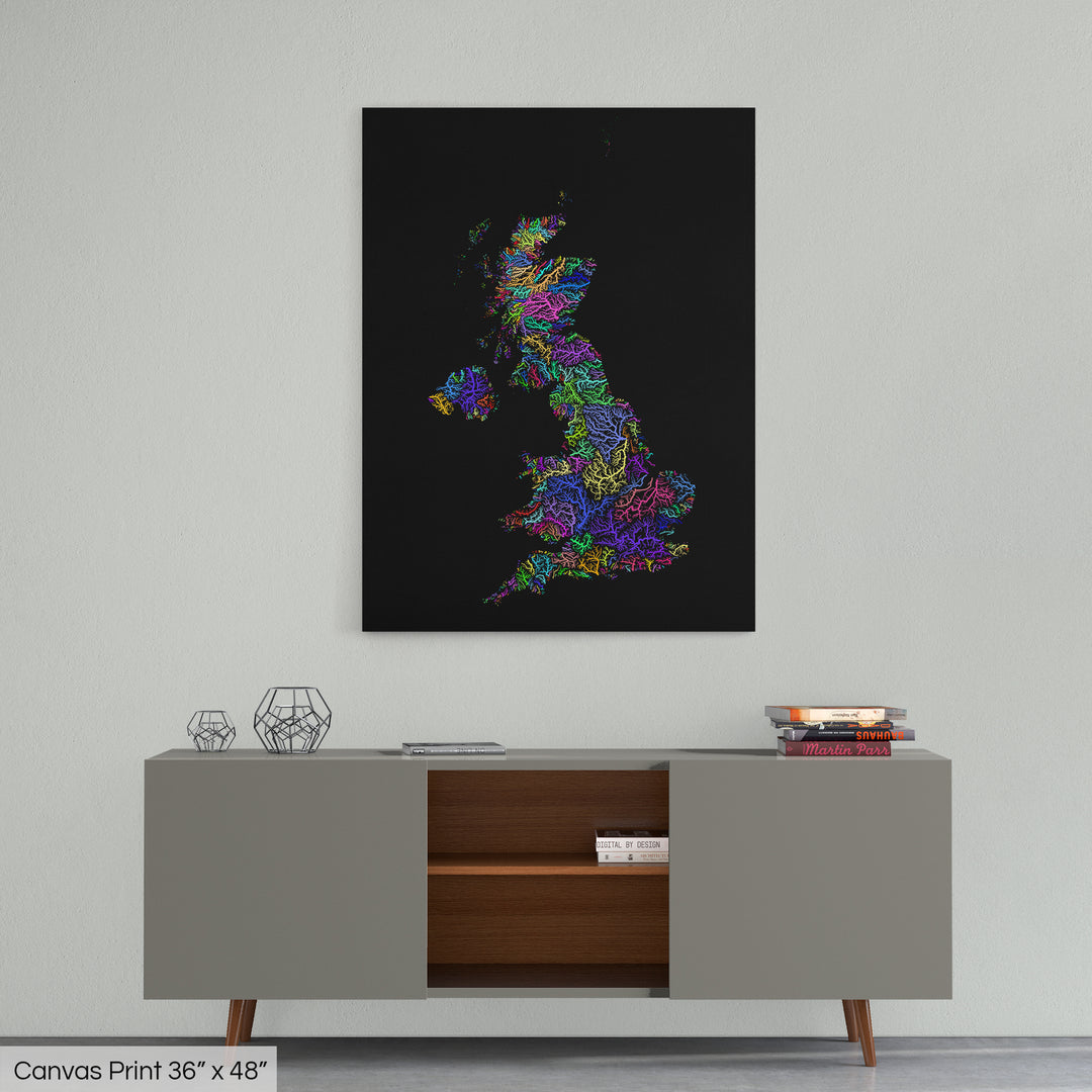 A colourful Grasshopper Geography map home decor in a living room, on a light grey wall. The map is printed on canvas and hangs above a modern low storage cabinet.