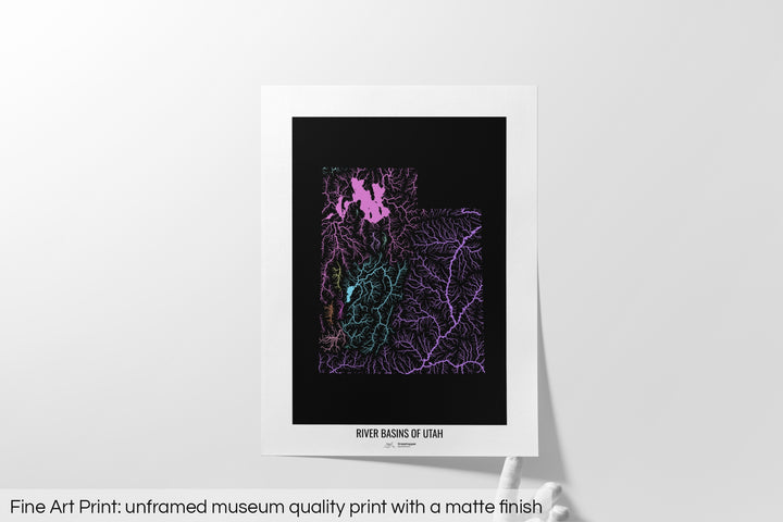 Unframed fine art print of a colourful map with a thick white mat. The title of the map and the Grasshopper Geography logo is printed on the mat, below the image. The map print lies flat on a white surface, a hand holding up one of the corners. The bottom text reads: Fine art print - unframed museum quality print with a matte finish.