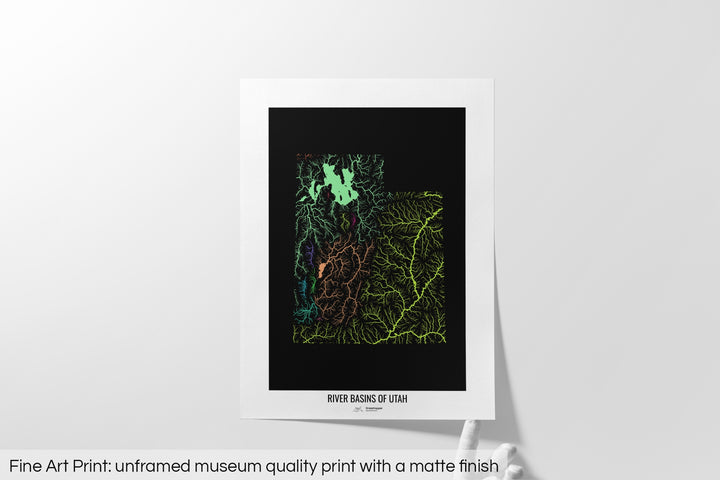 Unframed fine art print of a colourful map with a thick white mat. The title of the map and the Grasshopper Geography logo is printed on the mat, below the image. The map print lies flat on a white surface, a hand holding up one of the corners. The bottom text reads: Fine art print - unframed museum quality print with a matte finish.