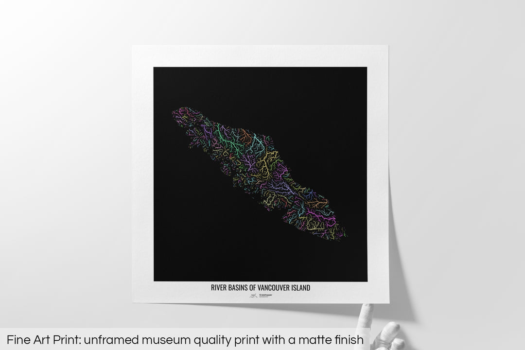 Unframed fine art print of a colourful map with a thick white mat. The title of the map and the Grasshopper Geography logo is printed on the mat, below the image. The map print lies flat on a white surface, a hand holding up one of the corners. The bottom text reads: Fine art print - unframed museum quality print with a matte finish.