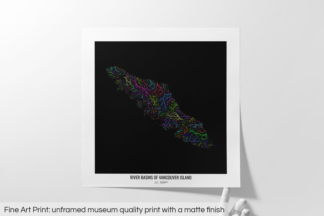 Unframed fine art print of a colourful map with a thick white mat. The title of the map and the Grasshopper Geography logo is printed on the mat, below the image. The map print lies flat on a white surface, a hand holding up one of the corners. The bottom text reads: Fine art print - unframed museum quality print with a matte finish.