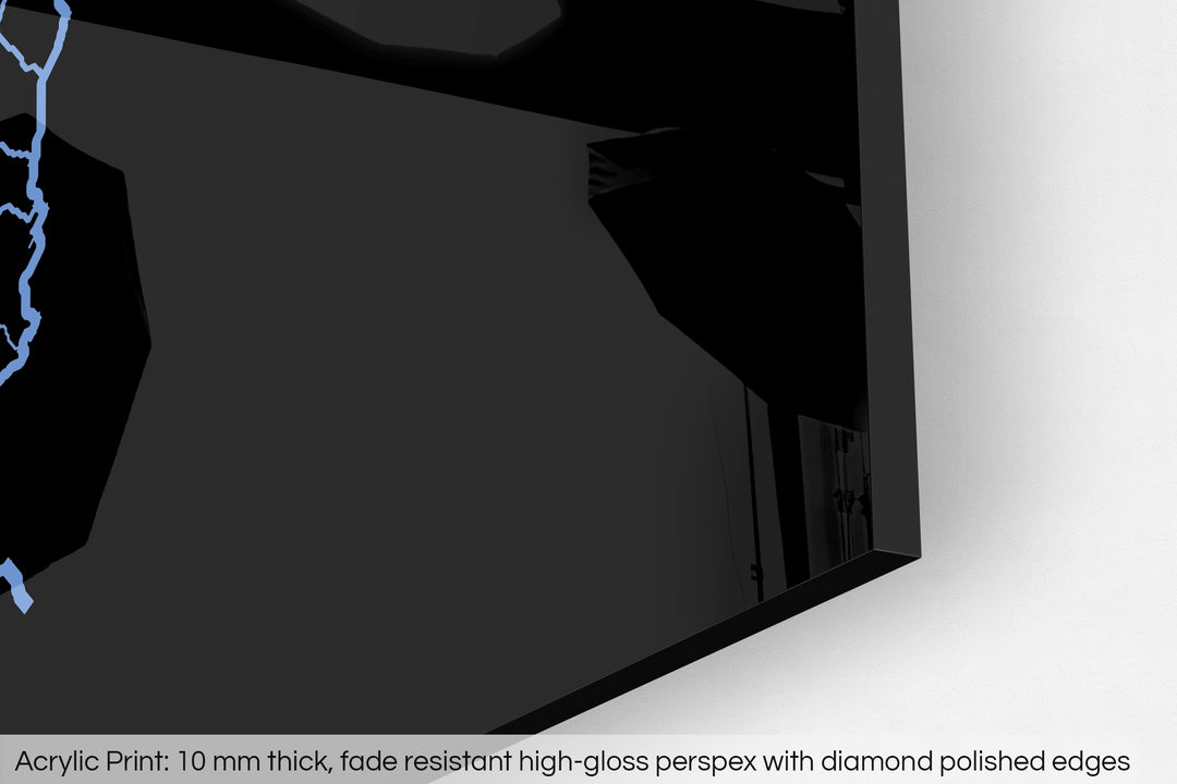 Closeup of an acrylic panel's corner, the details of a Grasshopper Geography map is visible. The text at the bottom reads: Acrylic print - 10 mm thick, fade reistant high-gloss perspex with diamond polished edges.