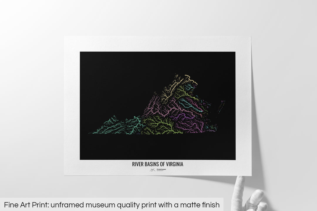 Unframed fine art print of a colourful map with a thick white mat. The title of the map and the Grasshopper Geography logo is printed on the mat, below the image. The map print lies flat on a white surface, a hand holding up one of the corners. The bottom text reads: Fine art print - unframed museum quality print with a matte finish.
