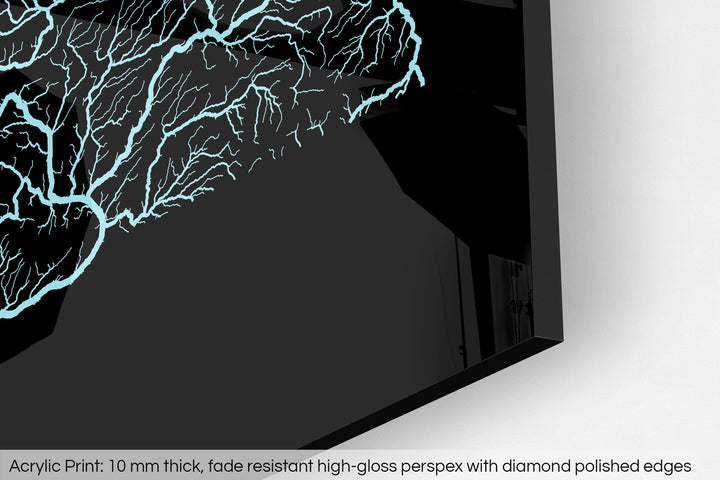 Closeup of an acrylic panel's corner, the details of a Grasshopper Geography map is visible. The text at the bottom reads: Acrylic print - 10 mm thick, fade reistant high-gloss perspex with diamond polished edges.