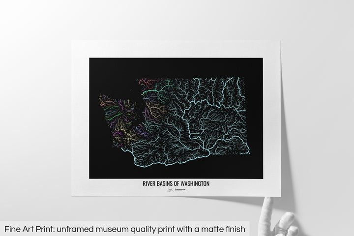 Unframed fine art print of a colourful map with a thick white mat. The title of the map and the Grasshopper Geography logo is printed on the mat, below the image. The map print lies flat on a white surface, a hand holding up one of the corners. The bottom text reads: Fine art print - unframed museum quality print with a matte finish.