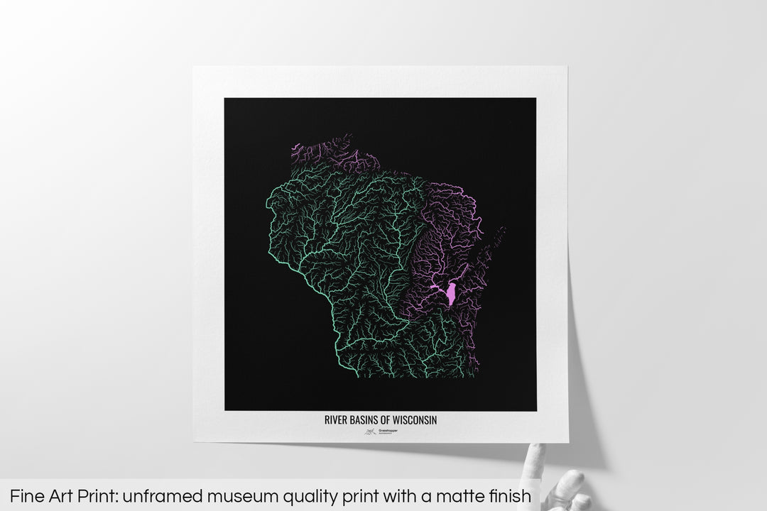 Unframed fine art print of a colourful map with a thick white mat. The title of the map and the Grasshopper Geography logo is printed on the mat, below the image. The map print lies flat on a white surface, a hand holding up one of the corners. The bottom text reads: Fine art print - unframed museum quality print with a matte finish.
