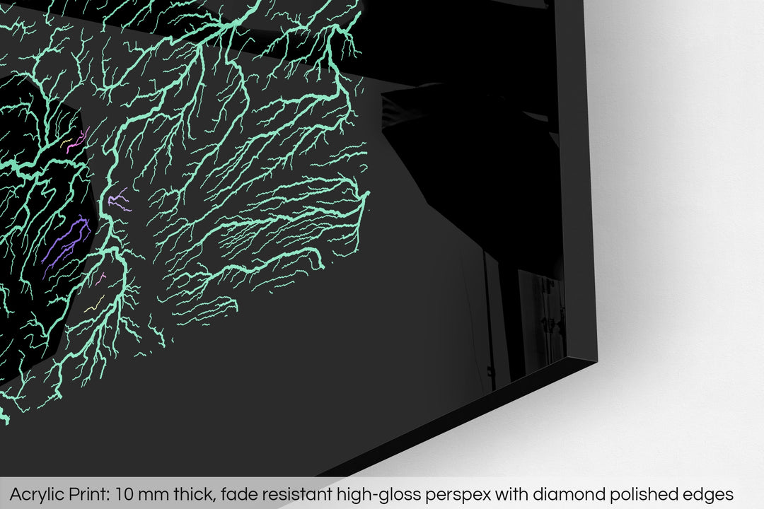 Closeup of an acrylic panel's corner, the details of a Grasshopper Geography map is visible. The text at the bottom reads: Acrylic print - 10 mm thick, fade reistant high-gloss perspex with diamond polished edges.