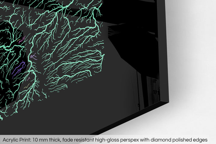 Closeup of an acrylic panel's corner, the details of a Grasshopper Geography map is visible. The text at the bottom reads: Acrylic print - 10 mm thick, fade reistant high-gloss perspex with diamond polished edges.