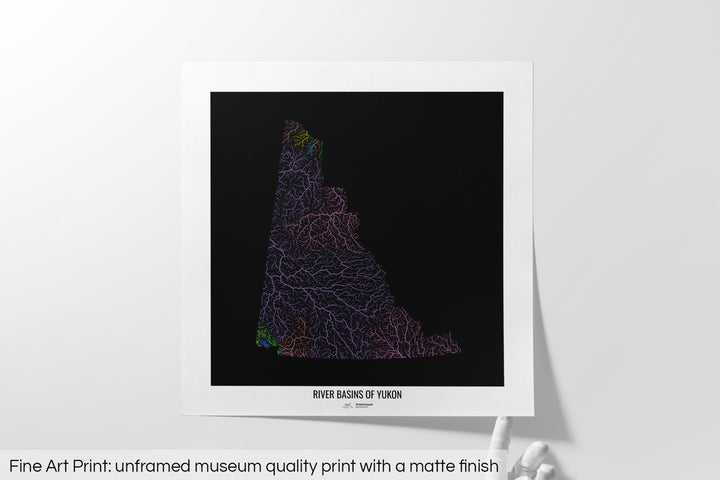 Unframed fine art print of a colourful map with a thick white mat. The title of the map and the Grasshopper Geography logo is printed on the mat, below the image. The map print lies flat on a white surface, a hand holding up one of the corners. The bottom text reads: Fine art print - unframed museum quality print with a matte finish.