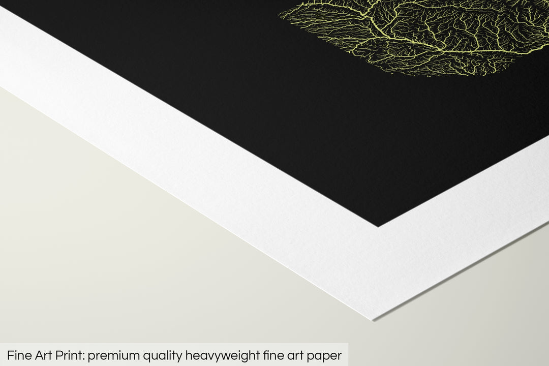 Closeup of a fine art print's corner lying on a flat surface, the details of a Grasshopper Geography map is visible. The text at the bottom reads: Fine art print - premium quality heavyweight fine art paper.