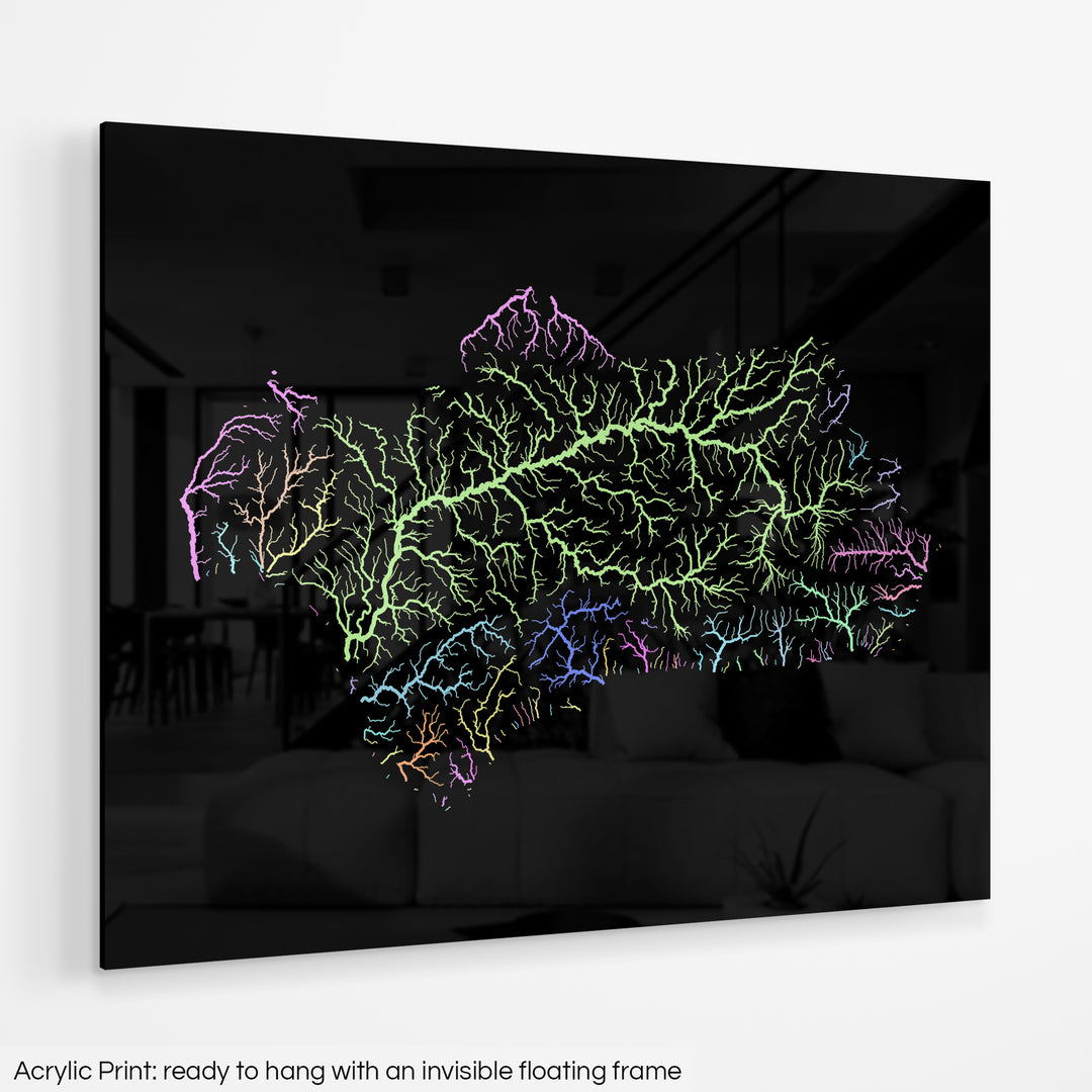 A colourful Grasshopper Geography map hanging on a white wall. The text at the bottom reads: Acrylic print - ready to hang with an invisible floating frame.