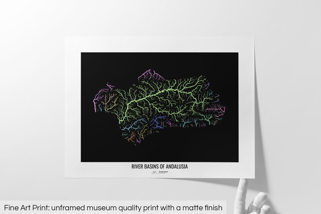 Unframed fine art print of a colourful map with a thick white mat. The title of the map and the Grasshopper Geography logo is printed on the mat, below the image. The map print lies flat on a white surface, a hand holding up one of the corners. The bottom text reads: Fine art print - unframed museum quality print with a matte finish.