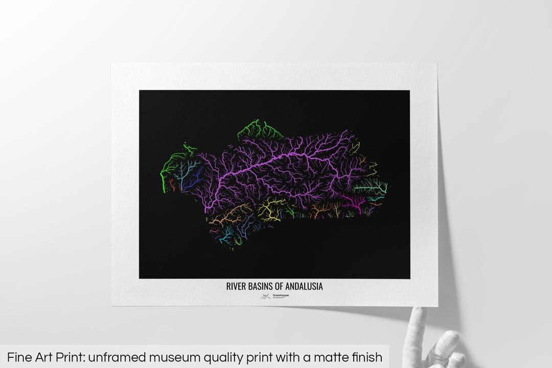 Unframed fine art print of a colourful map with a thick white mat. The title of the map and the Grasshopper Geography logo is printed on the mat, below the image. The map print lies flat on a white surface, a hand holding up one of the corners. The bottom text reads: Fine art print - unframed museum quality print with a matte finish.