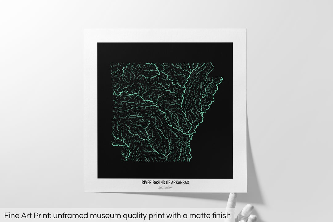 Unframed fine art print of a colourful map with a thick white mat. The title of the map and the Grasshopper Geography logo is printed on the mat, below the image. The map print lies flat on a white surface, a hand holding up one of the corners. The bottom text reads: Fine art print - unframed museum quality print with a matte finish.